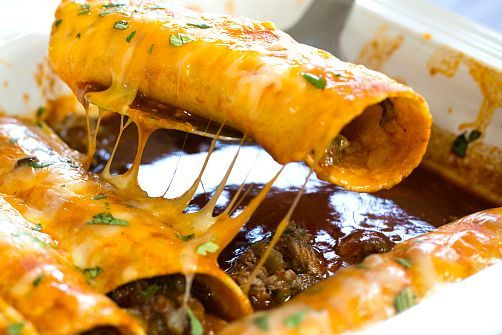 Mexican Lunch Catering. Enchiladas is a spicy red sauce with melted cheese on top