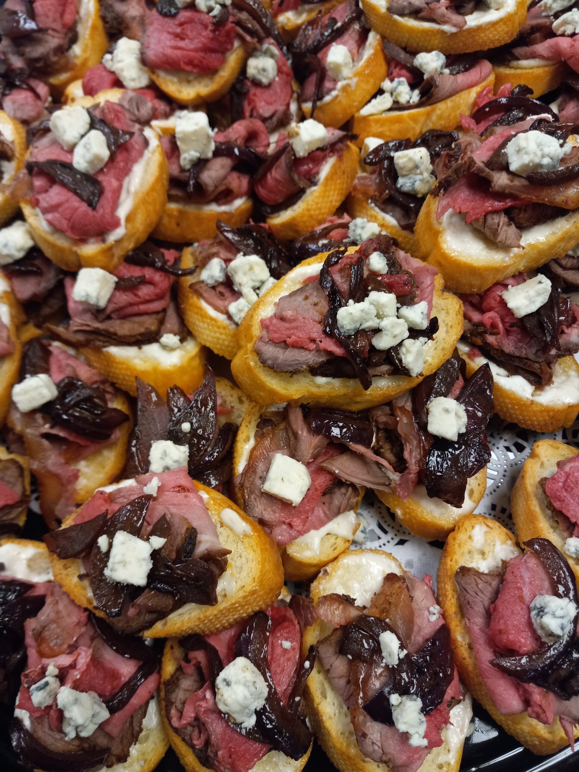 Beef Tenderloin on Crostini with Blue Cheese and Caramelized Onions