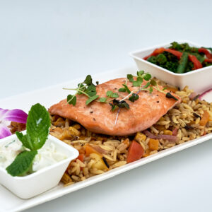 Inflight catering salmon with rice pilaf. Served with a green bean salad.